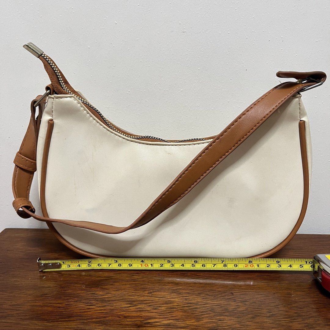 Cream and Brown Shoulder Bag (Category: Shoulder Bags) located in Quezon City. Submitted by julia_ppp (Listing ID 1464470709, Image 1). Description: issue: some staining on the leather.
