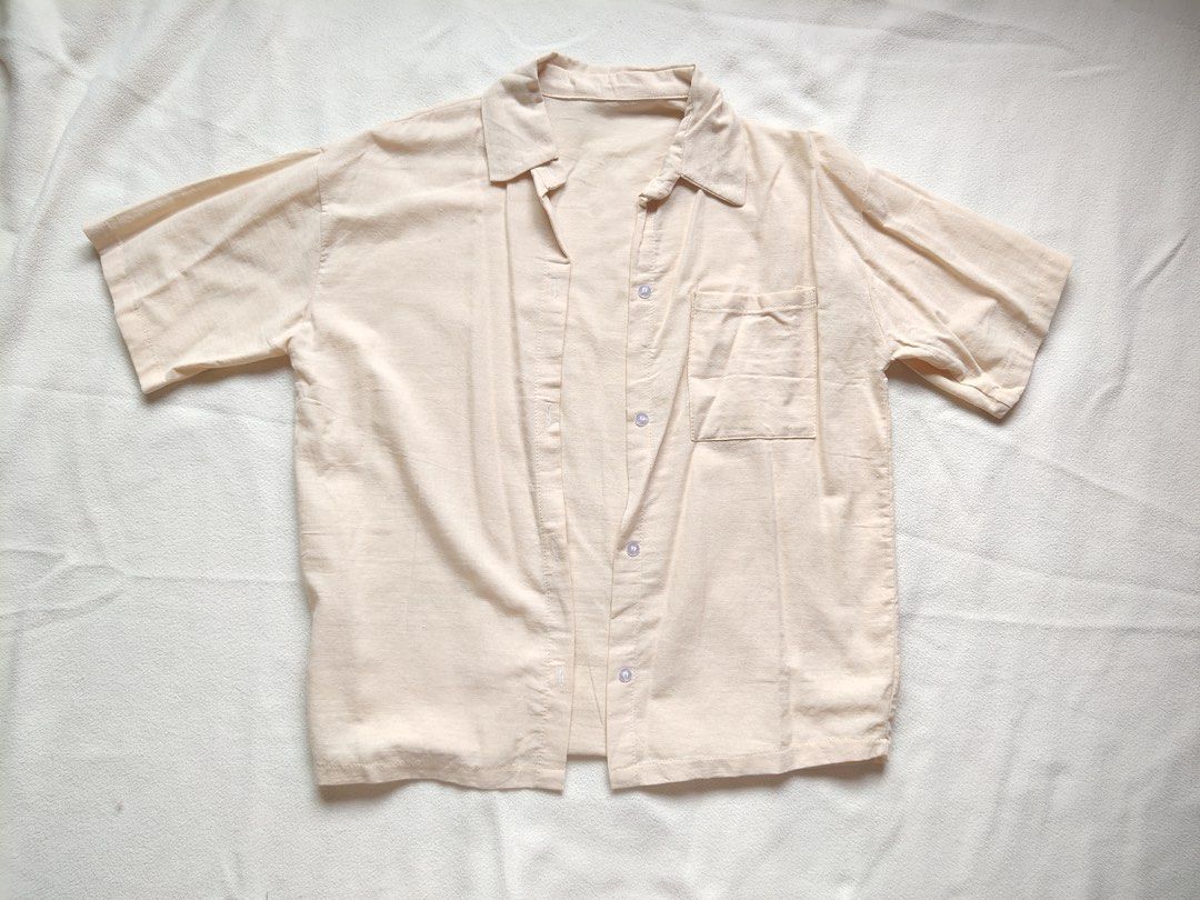 Cream Oversized Short Sleeve Button Up Shirt (Category: Shirts) located in Caloocan City. Submitted by angelinee123 (Listing ID 1464416914, Image 2). Description: Freesize - S to L •Payment methods: Gcash (item price + sf) • Payment first policy • Delivery option: - J&t delivery : 2-3 days depends on loc - Lalamove: same day delivery - meetup: 5th avenue lrt station only (cod avail) .