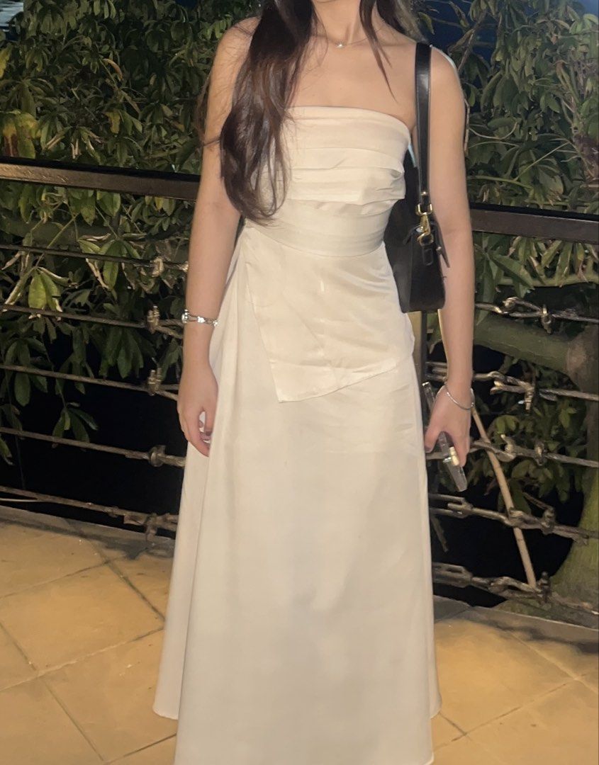 Cream Strapless Ruched Midi Dress (Category: Dresses) located in Caloocan City. Submitted by userj123456789 (Listing ID 1464515989, Image 1). Description: - Cream strapless midi dress - Ruched bodice - Wrap-style skirt - Ideal for events and parties - Worn only once for a wedding.