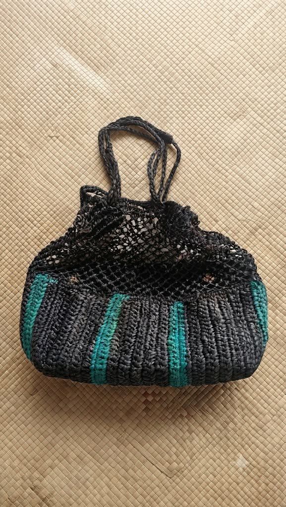Crocheted Handbag with Teal Stripes (Category: Shoulder Bags) located in Caloocan City. Submitted by maricelmac50585 (Listing ID 1464511966, Image 1). Description: - This is an ARANAZ Arruga Mini Bucket Bag (handwoven from natural fibers and materials with a slouchy, textured net design). - Handwoven bag with a unique crochet top - Stylish dark grey and teal stripe pattern on the bottom half - Durable braided handles - Offers a unique texture and