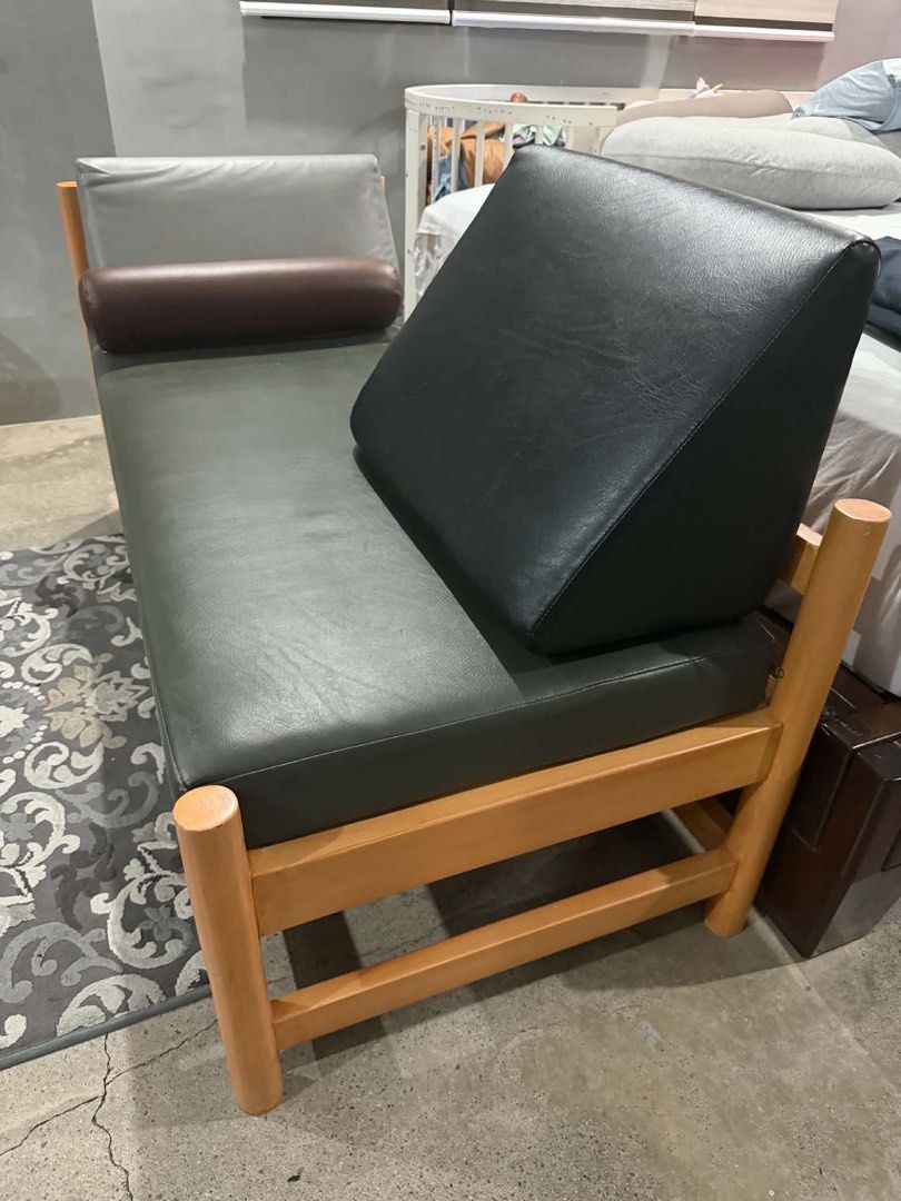 Custom Wooden Frame Daybed with Cushions (Category: Bed Frames & Mattresses) located in Quezon City. Submitted by thejowsh (Listing ID 1464386343, Image 1). Description: - Wooden frame daybed with natural finish - Dark grey upholstery - Includes one bolster pillow - Includes two back cushions (grey and black) - Simple, modern design - Ideal for lounging or extra seating - Fits most living spaces.