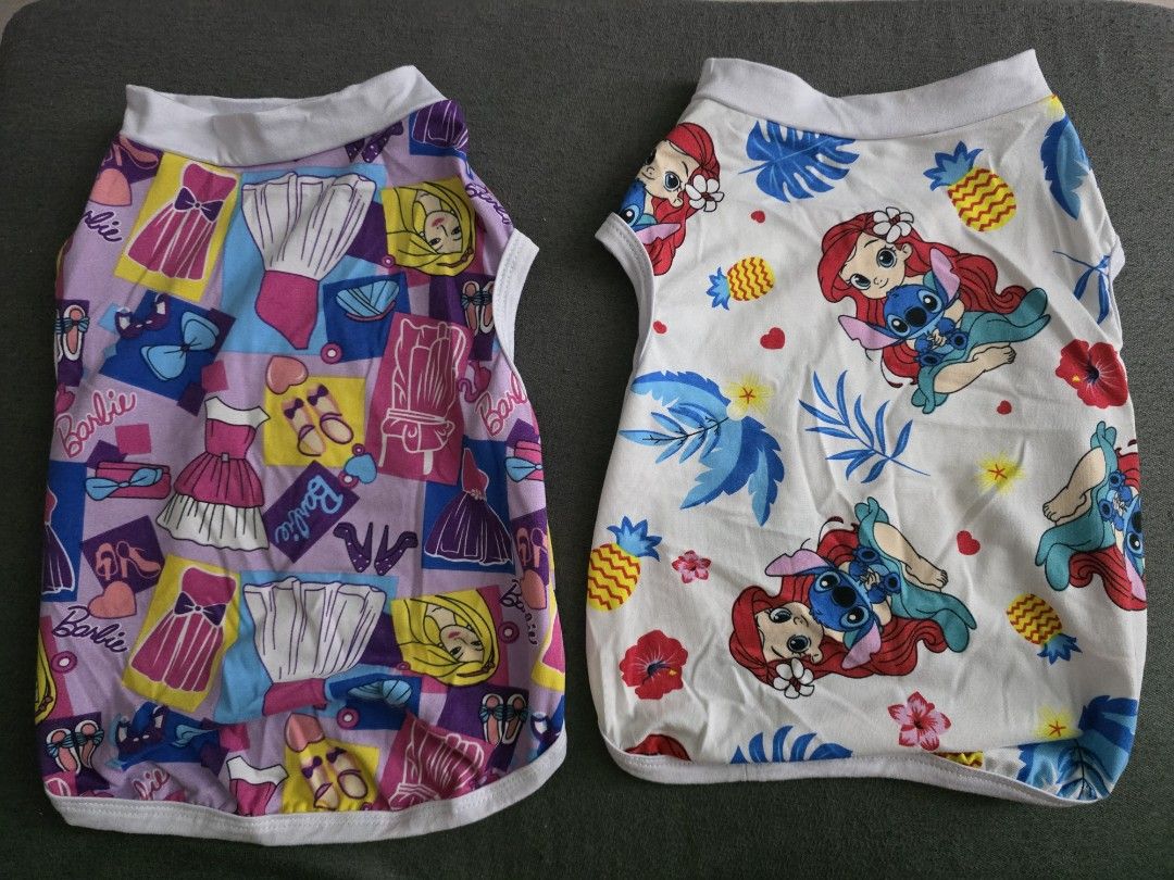 Cute Pet Clothes - Various Designs (Category: Homes & Other Pet Accessories) located in Bacoor. Submitted by stuffatbp.ph (Listing ID 1464525074, Image 3). Description: - Take ALL! Bundle of adorable pet shirts! - Fun designs: pandas, boba tea, Barbie, Little Mermaid, zebra print, cats, flowers, and 'BINI' text. - Sleeveless style for comfort and freedom of movement. - Made from soft and breathable fabric to keep your pet cool. - Perfect for mixi