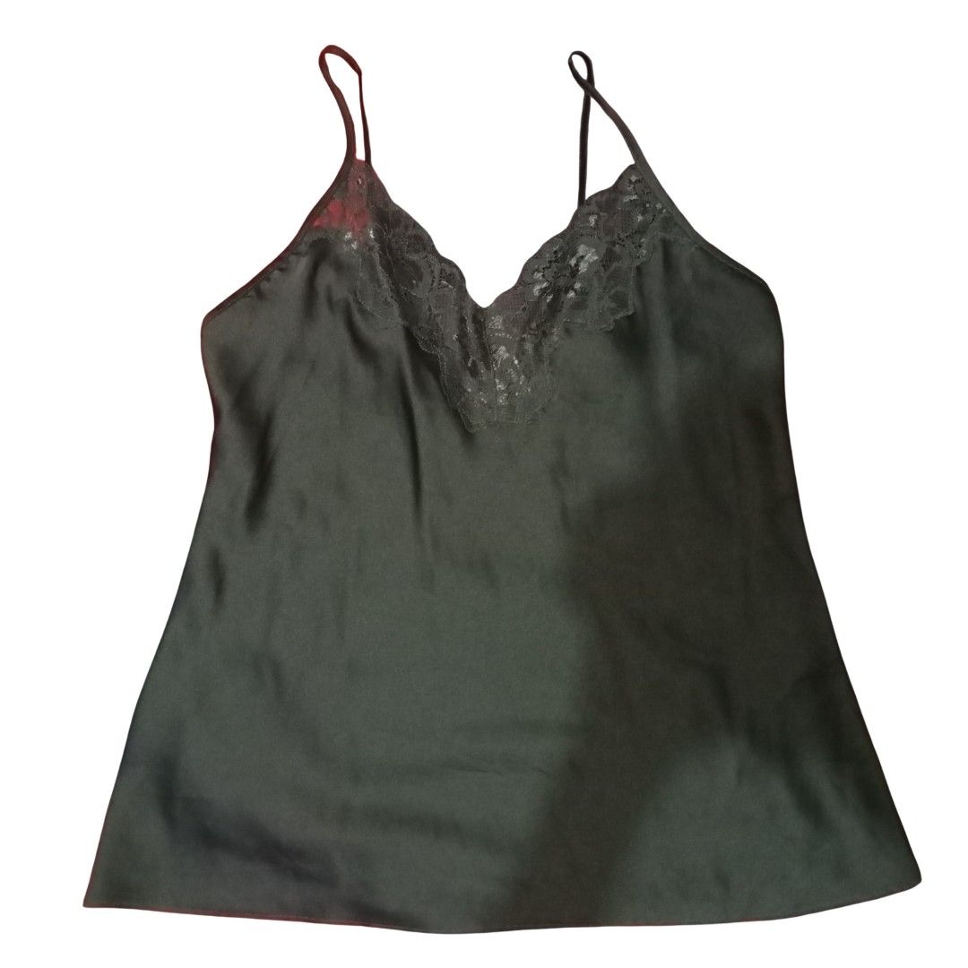Dark Green Lace Trim Cami Top (Category: Sleeveless) located in Baguio. Submitted by tequilamojito (Listing ID 1464472287, Image 1). Description: - Dark green satin cami top - Delicate lace trim along neckline - Adjustable spaghetti straps - Estimated size: Small to Medium - Soft and comfortable material - Versatile: perfect for layering or wearing solo.