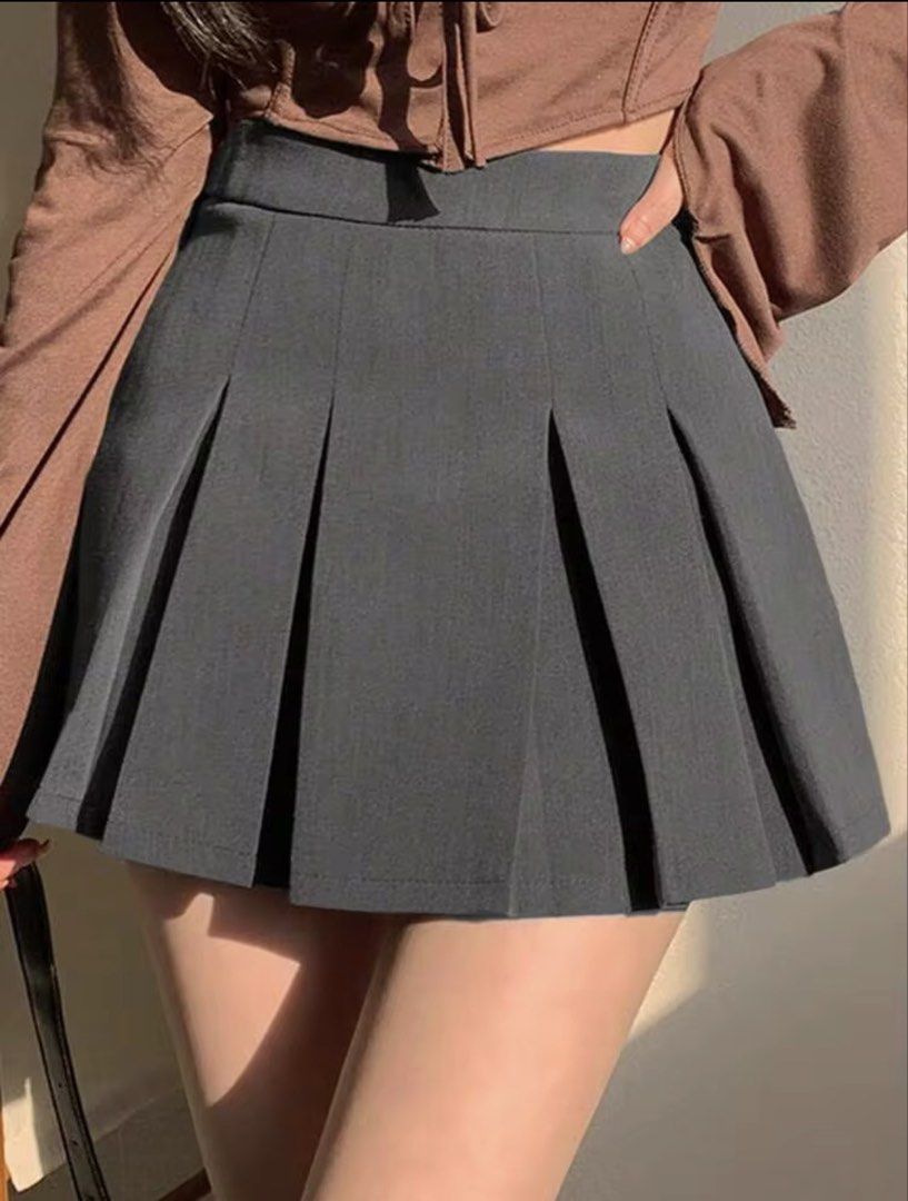 Dark Grey Pleated Mini Skirt (Category: Skirts) located in Villasis. Submitted by juliaxgamboa (Listing ID 1464438813, Image 1). Description: - Best fits Small - Cute dark grey pleated mini skirt - High-waisted fit - Perfect for preppy or Y2K aesthetic - Easy to style with tops and boots - Great for casual outings or events.