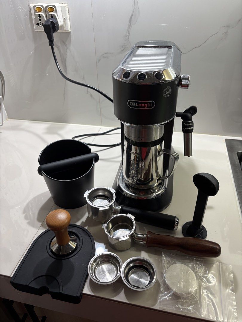 DeLonghi Espresso Machine with Accessories (Category: Coffee Machines & Makers) located in Pasig City. Submitted by eijisells (Listing ID 1464520627, Image 3). Description: FOR SALE — De’Longhi Dedica EC685 Espresso Machine + Barista Accessories ₱11,000 NEGOTIABLE Selling my De’Longhi Dedica EC685 complete espresso setup. Machine is around 3 years old, but well-maintained and in good working condition. The additional accessories were purchased on