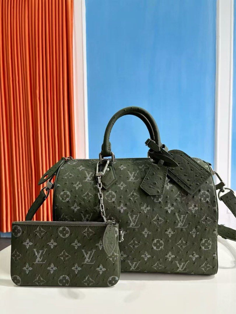 Designer Speedy Style Handbag with Matching Pouch (Category: Luxury Bags & Wallets) located in Manila. Submitted by azielnice1994 (Listing ID 1464540870, Image 2). Description: - Set includes Speedy-style handbag and matching pouch. - Unique textured ostrich-like leather. - Available colors: Red, Green, Grey. - Handbag features top handles and a detachable shoulder strap. - Pouch is ideal for organizing small essentials. - Versatile for everyday 