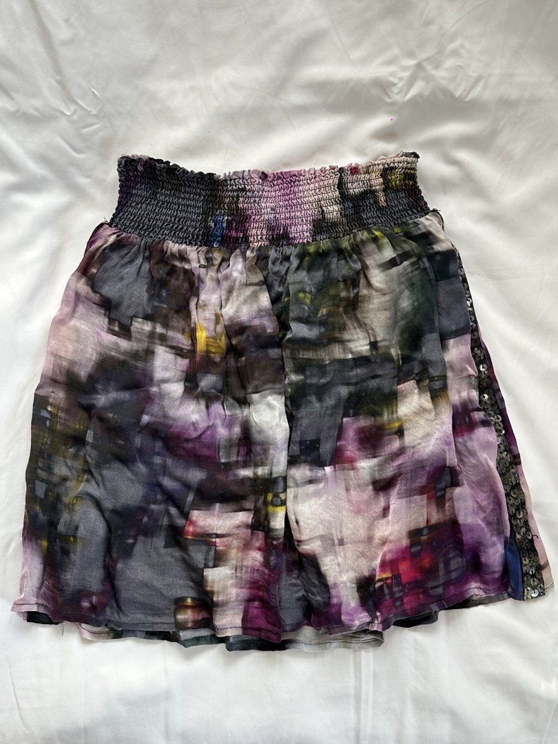 Desigual Abstract Print Mini Skirt with Sequin Trim (Category: Skirts) located in Cainta. Submitted by buy.preloved (Listing ID 1464375261, Image 1). Description: - Funky mini skirt - Abstract watercolor-like print - Smocked waistband for a comfy fit - Sequin trim detail on one side - Lightweight material - Perfect for dressing up or down.