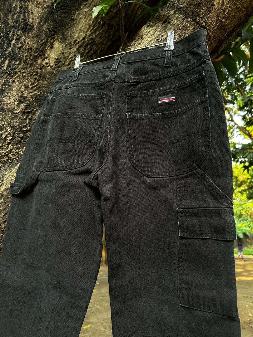 Dickies Black Carpenter Pants (Category: Jeans) located in Taguig. Submitted by actualizeboutique (Listing ID 1464432430, Image 3). Description: - Classic black Dickies carpenter pants - Made from durable denim material - Features multiple utility pockets - Straight leg fit for a comfortable silhouette - Versatile for both workwear and casual outfits - A timeless wardrobe staple.