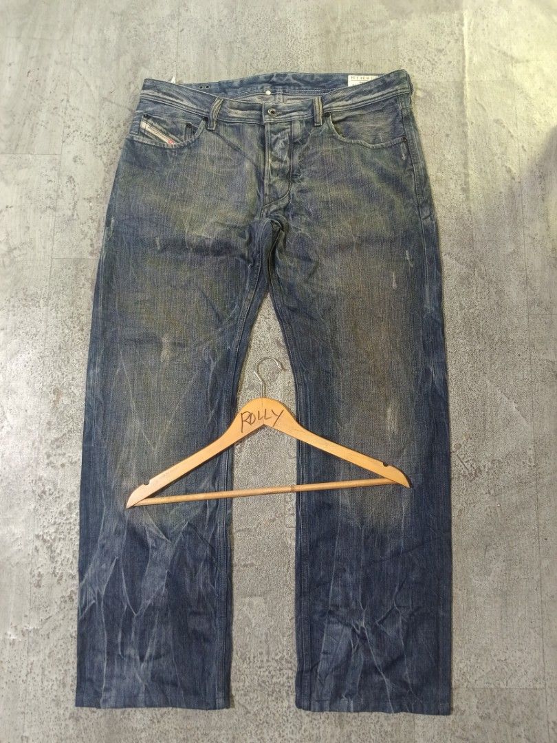 Diesel Jeans - Distressed Blue Denim (Category: Jeans) located in Carcar. Submitted by rolandobac92675 (Listing ID 1464395213, Image 3). Description: - Blue wash Diesel jeans - Distressed look with fading and creasing - Straight leg cut - Cuffed hems with striped detail - Button fly closure - Ideal for everyday wear.
