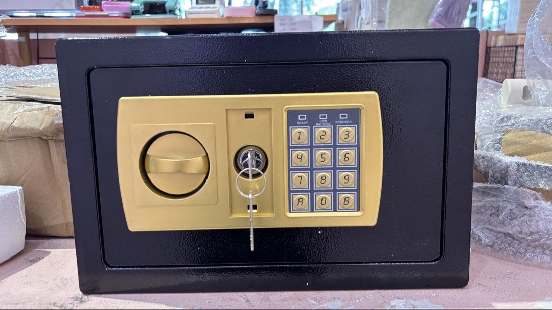Digital Electronic Safe Box with Key Lock (Category: Safe) located in Manila. Submitted by samantha7778 (Listing ID 1464540299, Image 3). Description: - Black digital safe box - Keypad and key entry for secure access - Convenient top slot for deposits - Ideal for home or office valuables - Requires batteries for digital keypad (not included) - Comes with 2 backup keys.