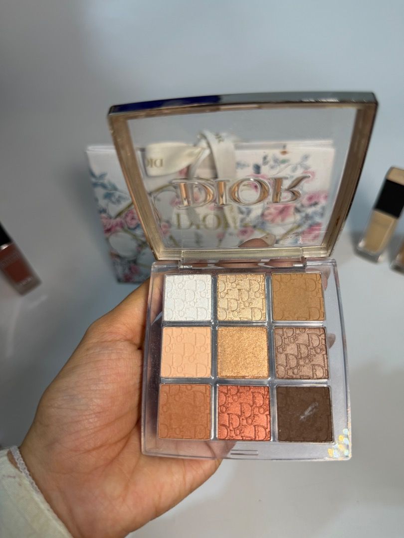 Dior 9-Color Eyeshadow Palette (Category: Makeup) located in Cebu City. Submitted by kyeshamori24 (Listing ID 1464456068, Image 2). Description: - Dior eyeshadow palette with 9 shades - Features neutral and warm tones - Some shades have the iconic Dior logo pressed in - Comes in a clear, elegant case - Versatile for everyday makeup or dramatic smoky eyes.