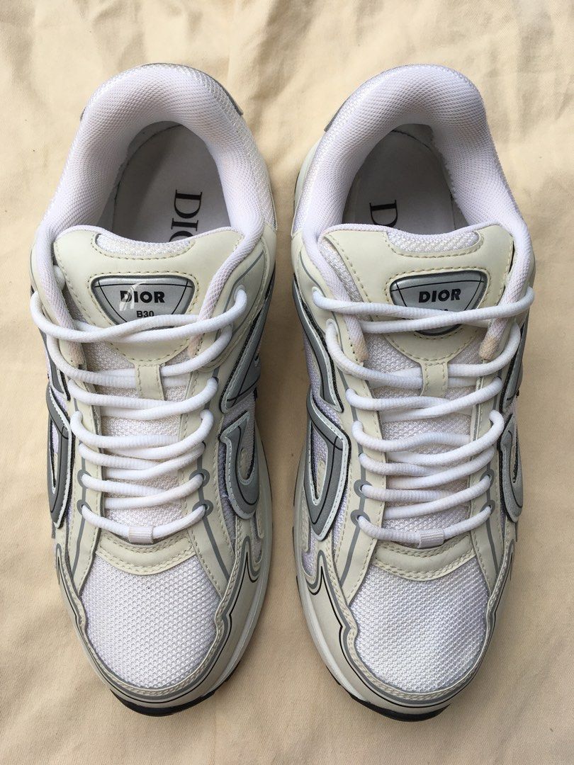 Dior B30 Sneakers for Men (Category: Sneakers) located in Taguig. Submitted by sorted_luxury (Listing ID 1464458672, Image 2). Description: - Dior B30 Sneakers for Men - Size: UK 8 / EU 42 - Colorway: White and Grey - Features: Classic CD logo on the side - Style: Comfortable and stylish, perfect for everyday wear.