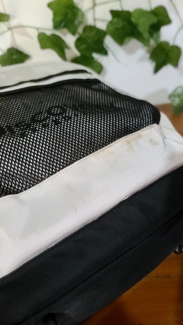 Discovery Backpack (Category: Backpacks) located in Baguio. Submitted by phoeberose33384 (Listing ID 1464567694, Image 3). Description: - White Discovery backpack - Side mesh pocket with Discovery logo - Light stains on the front - Protective studs on the bottom - Ideal for everyday use.