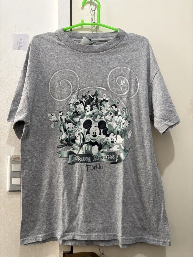 Disney Dreams Florida Graphic T-Shirt (Category: Tshirts & Polo Shirts ) located in Manila. Submitted by dominicoab75406 (Listing ID 1464373363, Image 1). Description: - Grey T-Shirt with 'Disney Dreams Florida' graphic print - Features beloved Disney characters like Mickey Mouse - Made from comfortable fabric for everyday wear - Ideal for casual outings and Disney enthusiasts - A great addition to any Disney fan's collection.