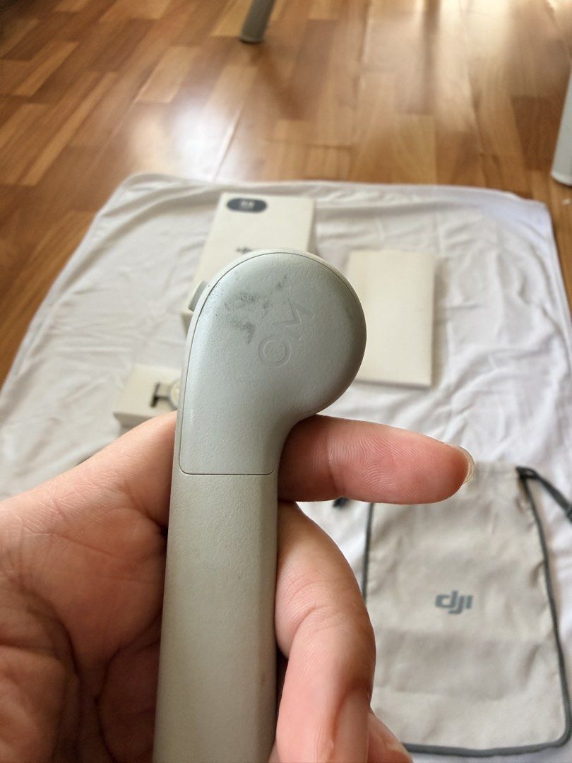 DJI OM 5 Smartphone Gimbal Stabilizer (Category: Gimbals & Stabilizers ) located in Antipolo. Submitted by mrgvictoria (Listing ID 1464379078, Image 3). Description: - DJI OM 5 Smartphone Gimbal - Perfect for achieving smooth, professional-looking video shots - Includes original box and all accessories - Comes with magnetic phone clamp, grip tripod, and carrying pouch - Minor cosmetic marks on tripod and gimbal handle from normal use - Fully func