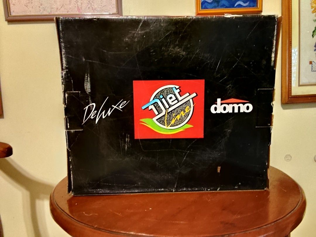 Dommo Pot with Pyrex Lid (Category: Cookware & Accessories) located in Quezon City. Submitted by mar13.ana.13 (Listing ID 1464409871, Image 3). Description: - Dommo Pot, 24 cm diameter - Includes Pyrex glass lid - Black interior and handles - Red induction-compatible base - Minor signs of wear on the metal rim - Ideal for everyday cooking.