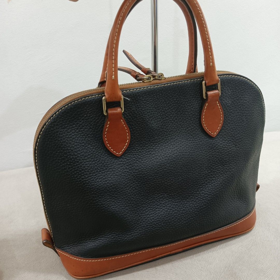 Dooney & Bourke Satchel Bag (Category: Luxury Bags & Wallets) located in Quezon City. Submitted by closetraiders.mnl (Listing ID 1464510166, Image 3). Description: Dooney & Bourke satchel bag - Tan leather trim and handles - Durable pebbled leather - Secure zipper closure.