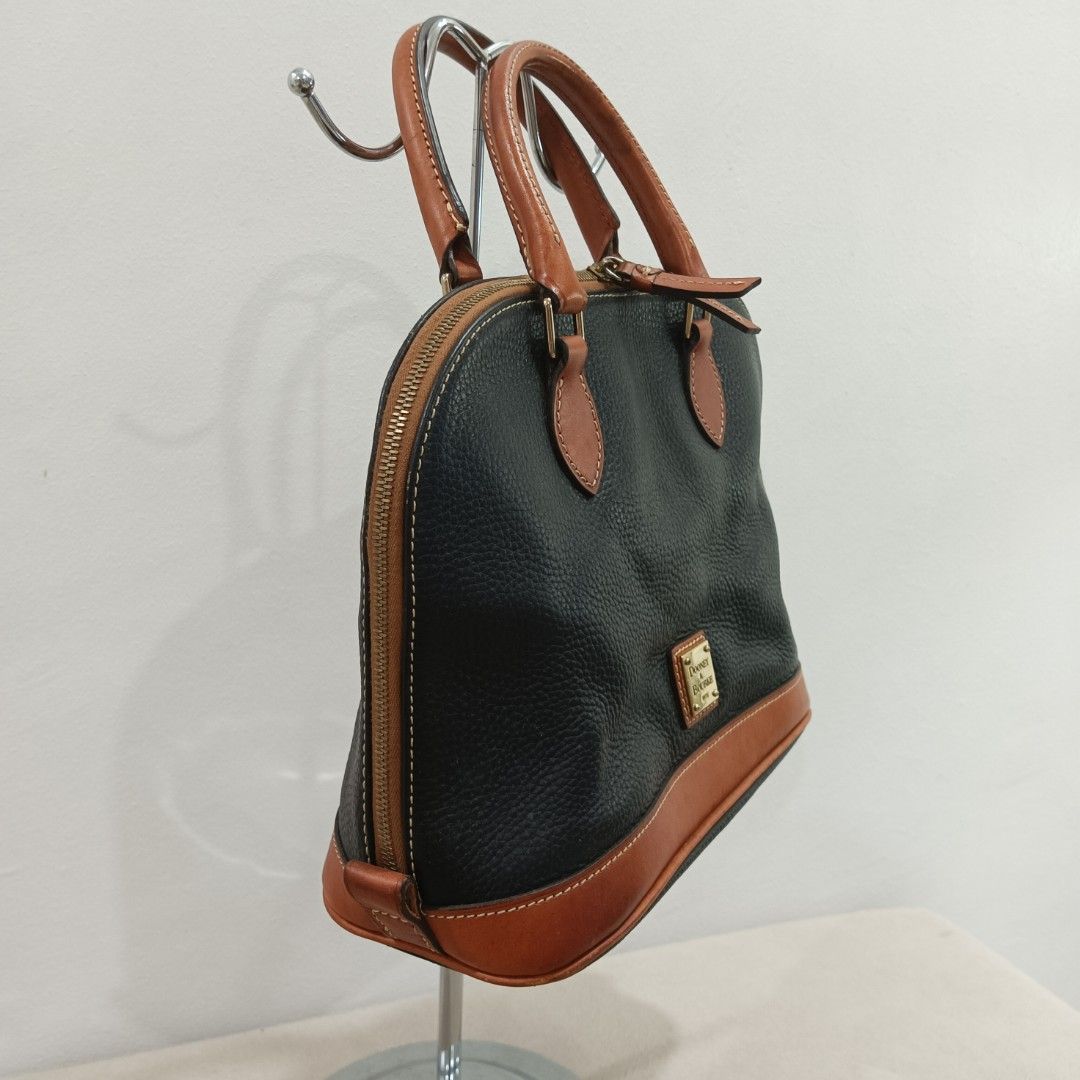 Dooney & Bourke Satchel Bag (Category: Luxury Bags & Wallets) located in Quezon City. Submitted by closetraiders.mnl (Listing ID 1464510166, Image 2). Description: Dooney & Bourke satchel bag - Tan leather trim and handles - Durable pebbled leather - Secure zipper closure.