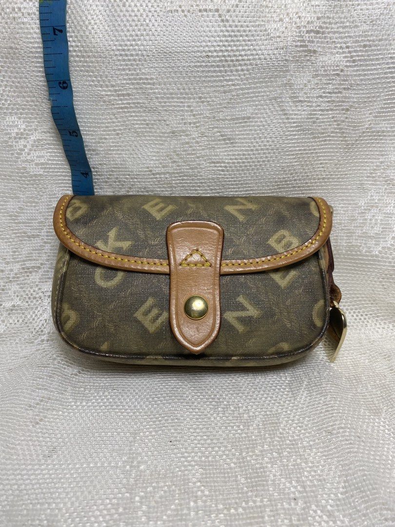 Dooney and bourke (Category: Purses & Pouches) located in Angeles City. Submitted by noagrace (Listing ID 1464471149, Image 1). Description: Vintage Dooney & Bourke signature monogram flap pouch coated canvas body with tan leather trim. Normal signs of use P450 last price .