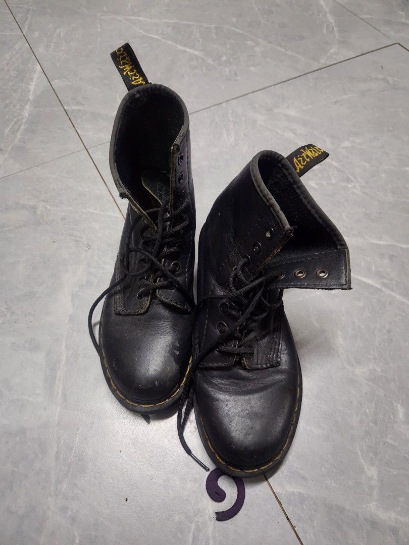 Dr. Martens 1460 Black Leather Boots (Category: Boots) located in Quezon City. Submitted by amber___18 (Listing ID 1464411352, Image 1). Description: - Classic Dr. Martens 1460 boots - Black leather - Lace-up style - Iconic yellow stitching - Perfect for everyday wear and styling.