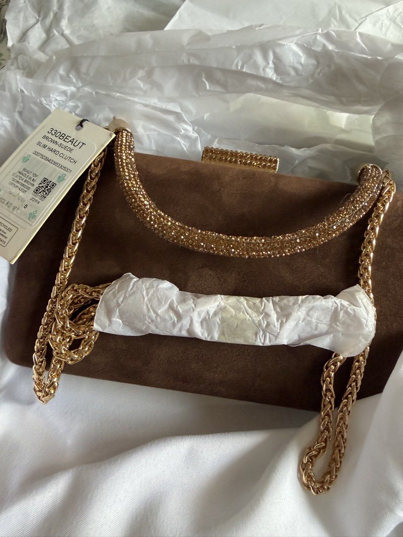 Dune brown suede evening bag (Category: Shoulder Bags) located in Pasig City. Submitted by stuffinmykloset (Listing ID 1464411223, Image 2). Description: Bnew with rustans tag and box.