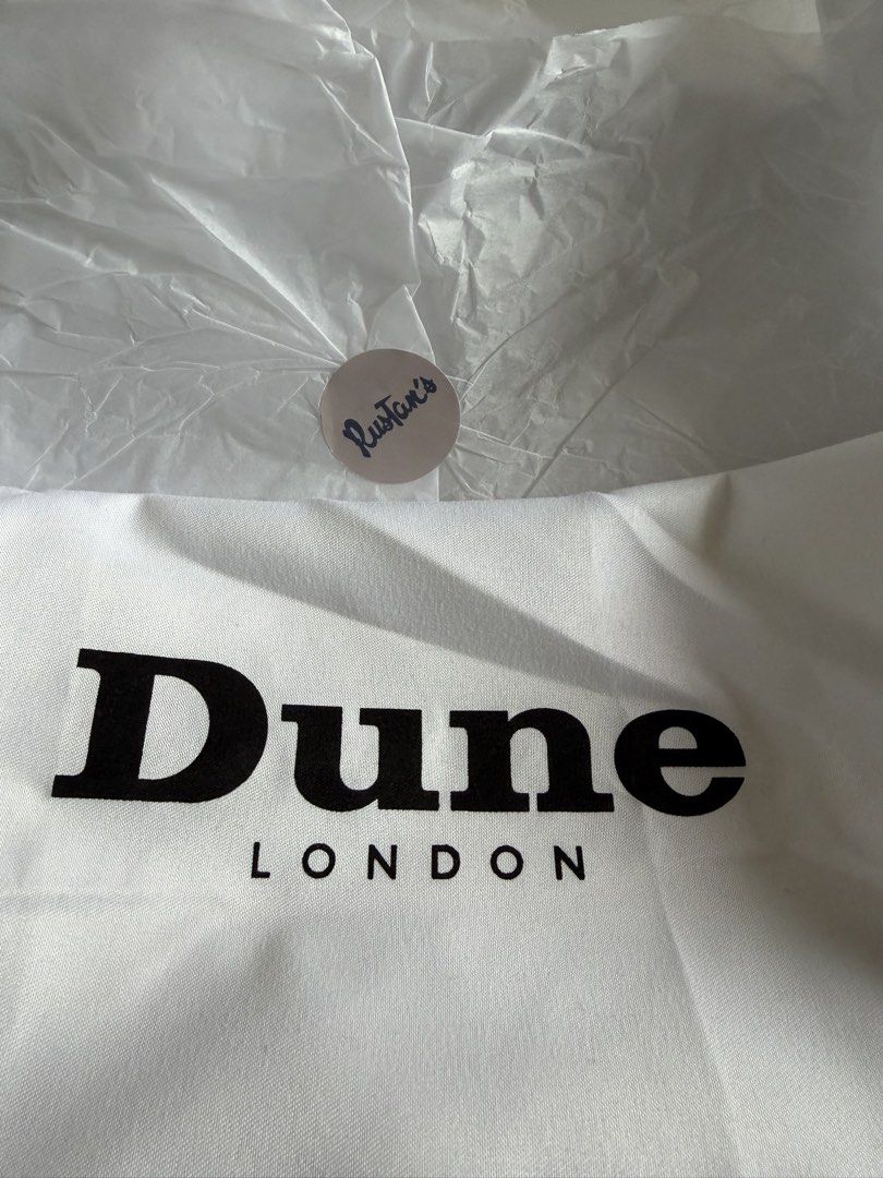 Dune brown suede evening bag (Category: Shoulder Bags) located in Pasig City. Submitted by stuffinmykloset (Listing ID 1464411223, Image 3). Description: Bnew with rustans tag and box.