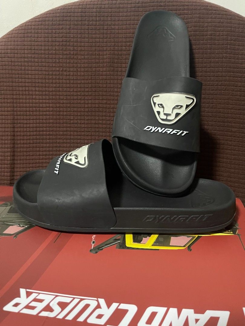Dynafit Black Slides (Category: Slippers & Slides) located in Davao. Submitted by dareyl_121422 (Listing ID 1464464036, Image 2). Description: - Dynafit slides in classic black. - Features the iconic Dynafit logo on the strap. - Designed for ultimate comfort, ideal for everyday wear or post-activity recovery. - Effortless slip-on style for convenience..