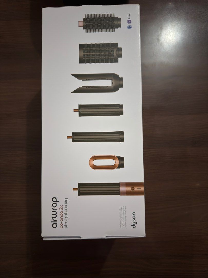 Dyson Airwrap Complete Long Co-anda 2x Straight+Wavy (Category: Hair) located in Manila. Submitted by chohanmani51652 (Listing ID 1464535329, Image 1). Description: - Dyson Airwrap Complete Long - Includes Co-Anda 2x Straight+Wavy attachments - Comes with various brush and barrel attachments - Main unit, power cord, and storage case included - Ideal for effortless hair styling.