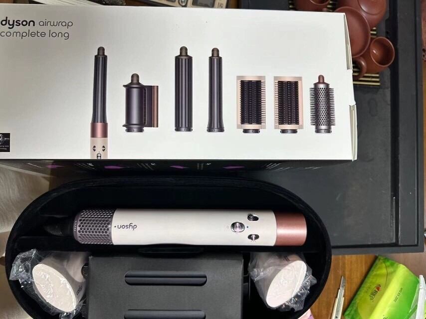 Dyson Airwrap Complete Long Hair Styler Set-HS05 (Category: Hair) located in Las Pinas. Submitted by gentletree_31ead6 (Listing ID 1464497150, Image 2). Description: - Dyson Airwrap Complete Long set - Includes main styler unit - Comes with curling, shaping, and smoothing attachments - Includes original storage case - All attachments neatly organized inside - Suitable for various hair types and styles.