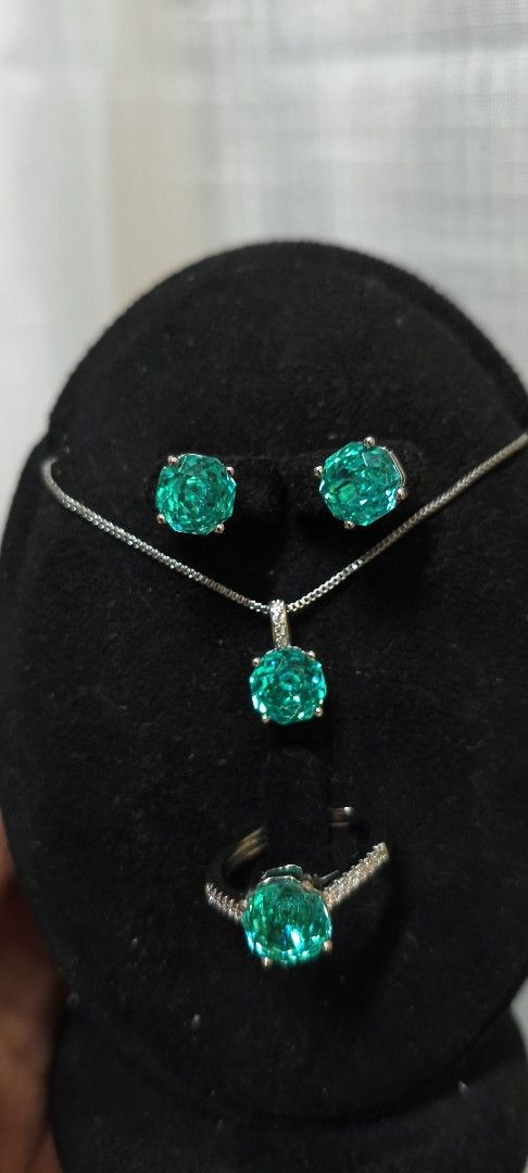 Emerald Green Gemstone Necklace, Earrings, and Ring Set (Category: Necklaces) located in Quezon City. Submitted by gemaicloset (Listing ID 1464407712, Image 1). Description: - Beautiful jewelry set featuring a vibrant emerald green gemstone. - Set includes a pendant necklace, matching stud earrings, and a ring. - Necklace features a delicate silver chain. - Ring band is accented with small stones and Adjustable - Adds a perfect pop of color to an