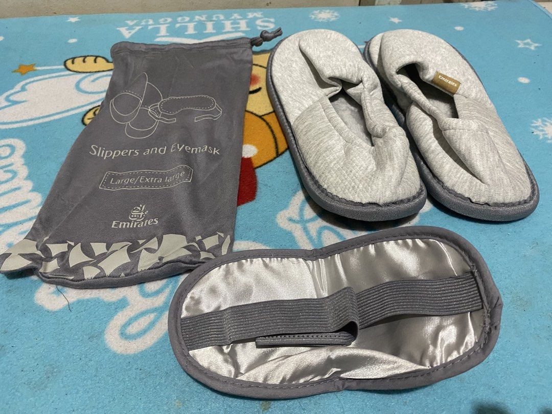 Emirates Airlines Slippers and Eyemask Set Large/Extra Large (Category: Slippers and slides) located in Manila. Submitted by resi.diaz (Listing ID 1464513787, Image 1). Description: - Emirates Airlines travel set - Includes grey slippers and eyemask - Comes with a matching grey drawstring pouch - Pouch size indicated as 'Large/Extra large' - Ideal for travel or lounging at home - Set is clean and ready for its new owner.