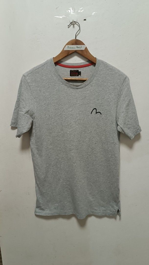 EVISU Grey T-shirt with Logo (Category: Tshirts & Polo Shirts ) located in Manila. Submitted by princess_1118 (Listing ID 1464366698, Image 1). Description: Grey Evisu tee. Features the iconic Evisu logo on the front left chest. Large Evisu text graphic on the back. Short sleeves and a crew neck. Comfortable cotton material. Great for casual wear..
