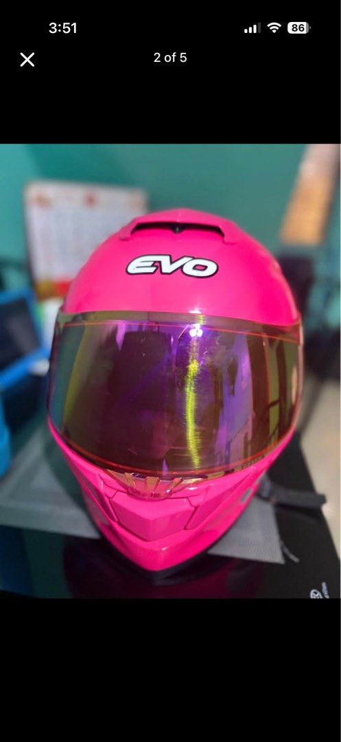 EVO Pink Full Face Motorcycle Helmet with Mirrored Visor (Category: Bicycles) located in Manila. Submitted by barney1219 (Listing ID 1464430193, Image 3). Description: - Pink EVO full-face helmet - Eye-catching mirrored visor with multi-color reflection - Aerodynamic design for a sleek look - Vents for optimal airflow and comfort - Perfect for riders who want to make a statement.