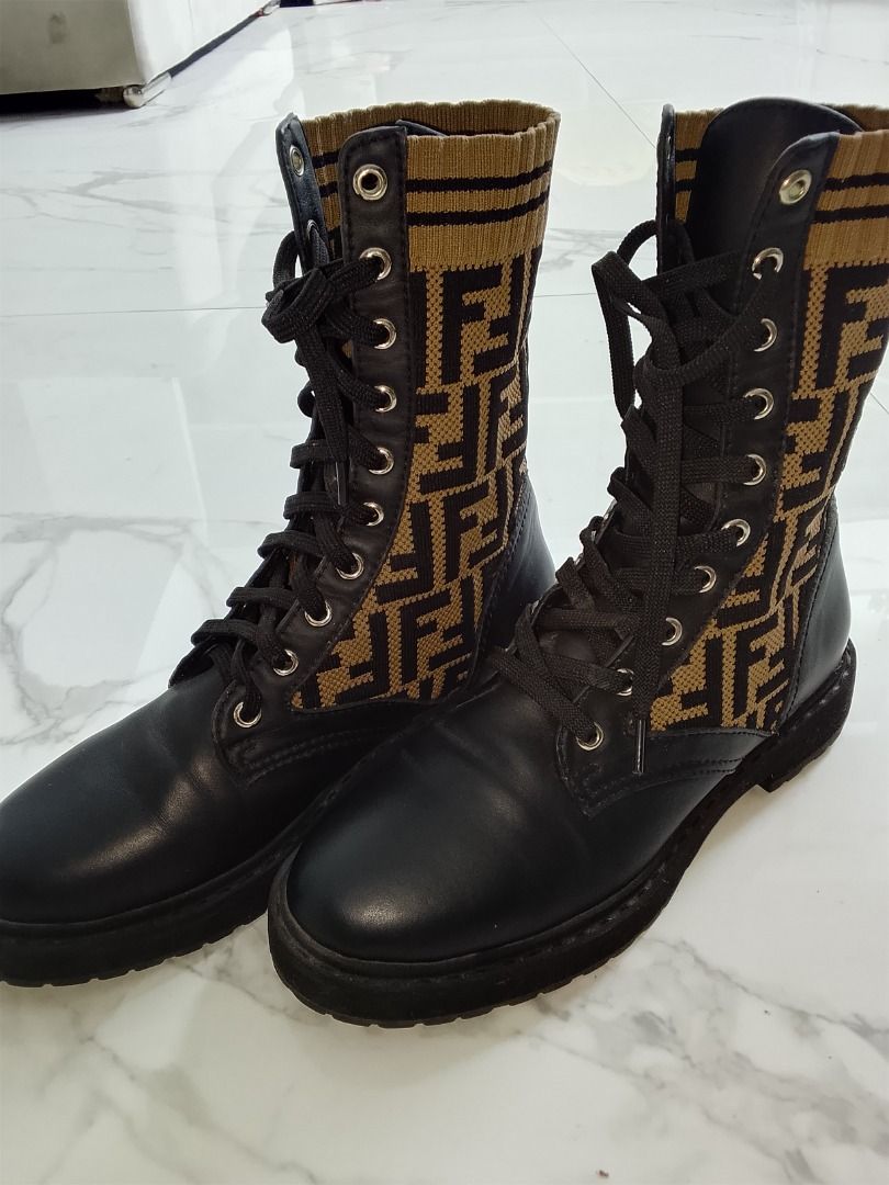 Fendi FF Monogram combat boots (Category: Boots) located in Quezon City. Submitted by kema2191 (Listing ID 1464414269, Image 1). Description: Fendi combat boots with iconic FF monogram fabric - Black leather details and laces - Statement piece for a designer flair - Features Fendi Roma logo on the insole - Perfect for fashion-forward individuals.