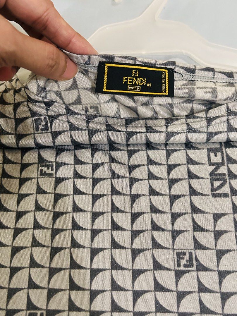 Fendi Monogram Sleeveless T-Shirt (Category: Sleeveless) located in Manila. Submitted by frommyclosettoyours016 (Listing ID 1464388852, Image 3). Description: - Authentic Fendi top - All-over iconic FF monogram pattern - Sleeveless design - Made in Italy - Measurements: Pit to pit approx 16 inches, length approx 24 inches - A must-have for Fendi enthusiasts.