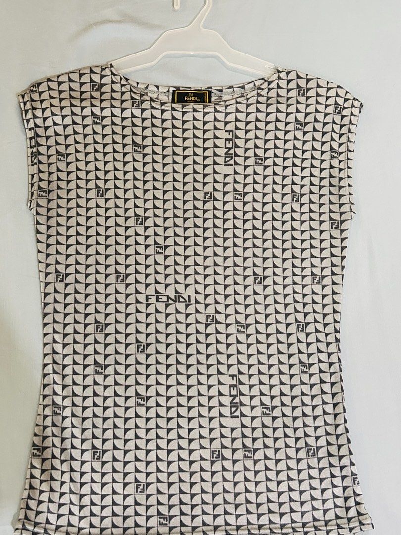 Fendi Monogram Sleeveless T-Shirt (Category: Sleeveless) located in Manila. Submitted by frommyclosettoyours016 (Listing ID 1464388852, Image 1). Description: - Authentic Fendi top - All-over iconic FF monogram pattern - Sleeveless design - Made in Italy - Measurements: Pit to pit approx 16 inches, length approx 24 inches - A must-have for Fendi enthusiasts.