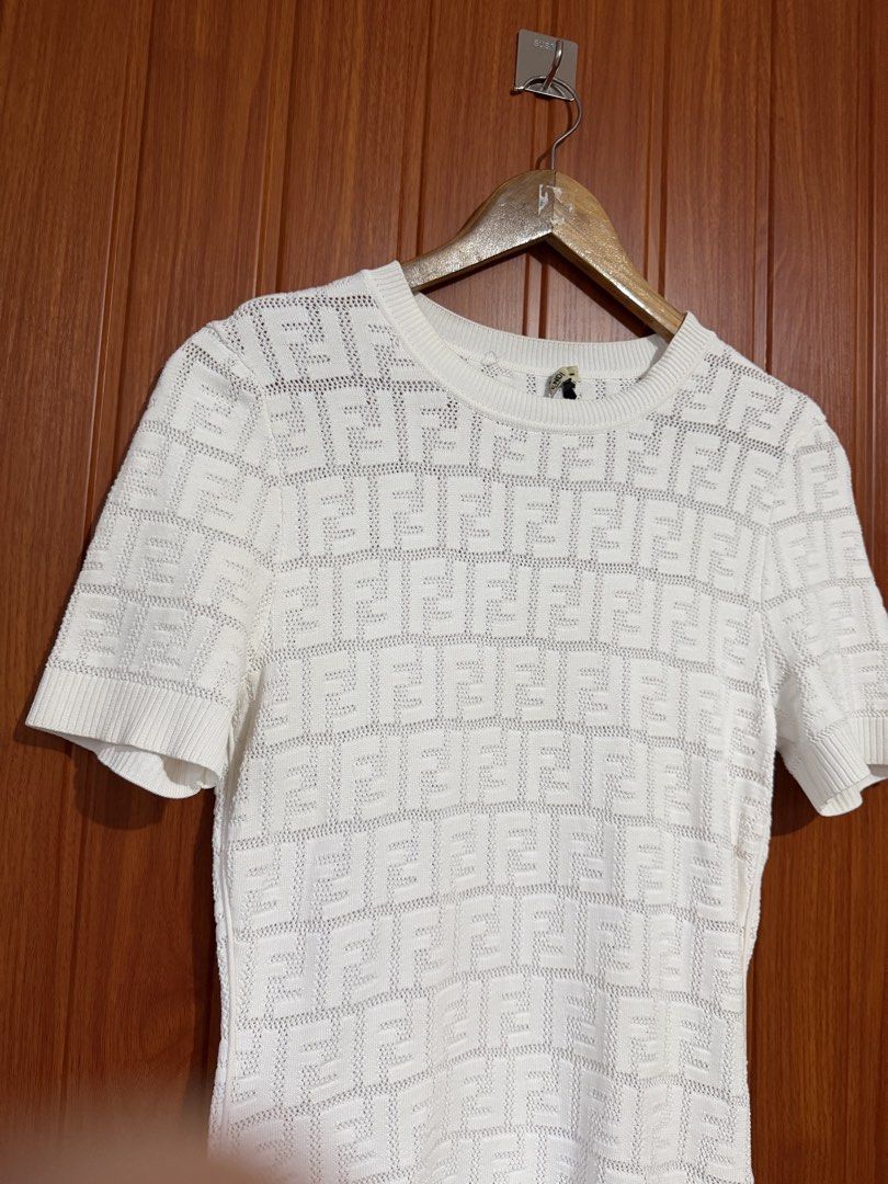 Fendi White FF Monogram Knit Top (Category: Blouses) located in Manila. Submitted by tlfph (Listing ID 1464536248, Image 3). Description: - Authentic White Fendi Knit Top - Iconic FF Monogram Pattern - Short Sleeves & Classic Crew Neck - Size: 38 - Made in Italy - Versatile for casual or dressed-up looks.