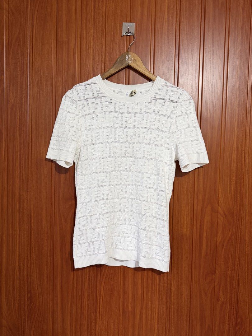 Fendi White FF Monogram Knit Top (Category: Blouses) located in Manila. Submitted by tlfph (Listing ID 1464536248, Image 1). Description: - Authentic White Fendi Knit Top - Iconic FF Monogram Pattern - Short Sleeves & Classic Crew Neck - Size: 38 - Made in Italy - Versatile for casual or dressed-up looks.