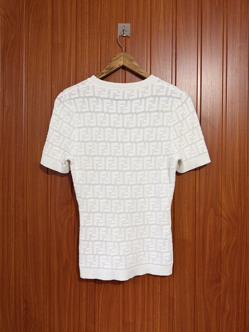Fendi White FF Monogram Knit Top (Category: Blouses) located in Manila. Submitted by tlfph (Listing ID 1464536248, Image 2). Description: - Authentic White Fendi Knit Top - Iconic FF Monogram Pattern - Short Sleeves & Classic Crew Neck - Size: 38 - Made in Italy - Versatile for casual or dressed-up looks.