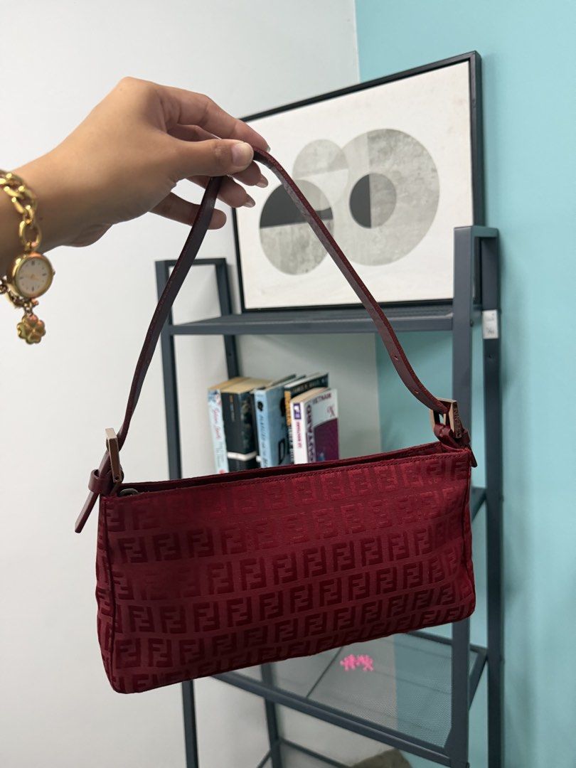 Fendi Zucca Pattern Shoulder Bag Burgundy (Category: Luxury Bags & Wallets) located in Manila. Submitted by previosly.mine (Listing ID 1464360756, Image 1). Description: - Classic Fendi baguette style shoulder bag - Rich burgundy color with iconic Zucca pattern - Genuine leather strap and details - Secure zipper closure - Ideal for everyday wear or a night out - Perfectly fits your essentials.