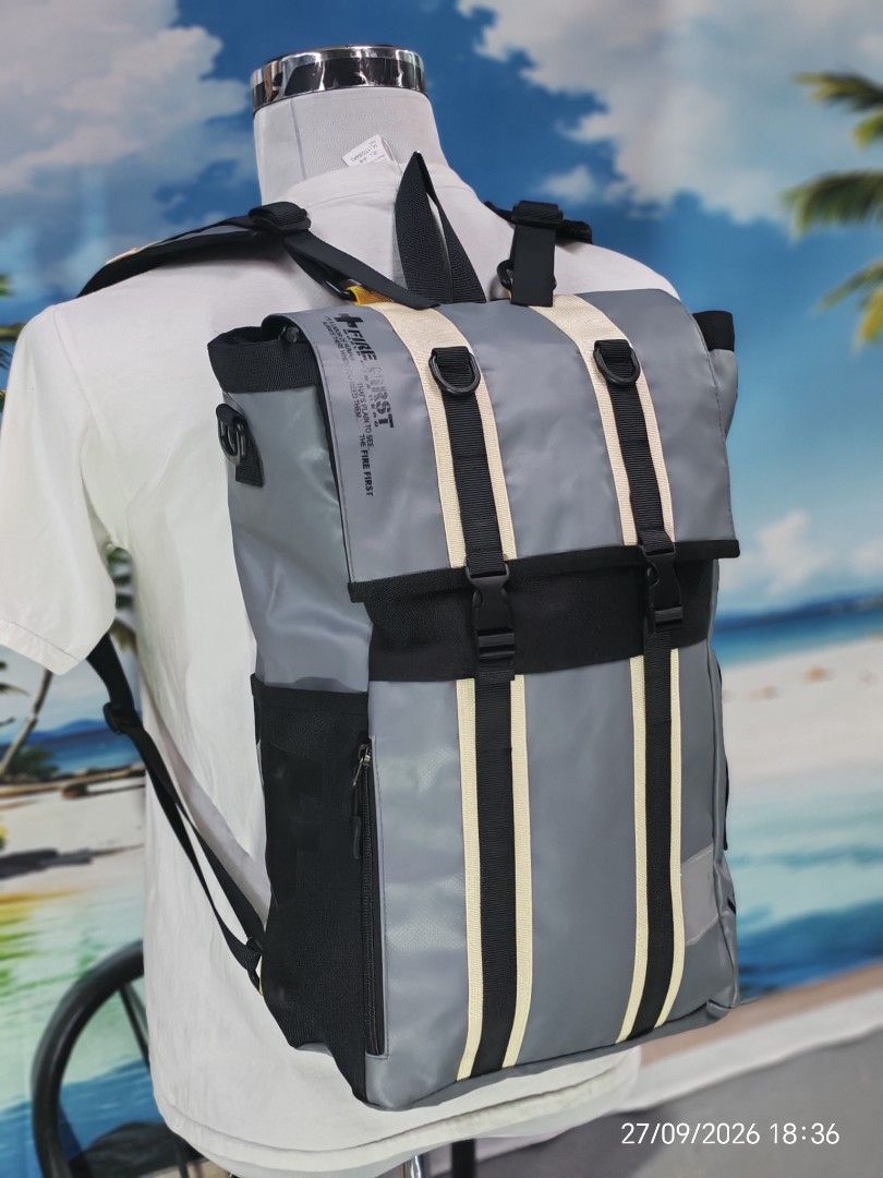 Fire first (Category: Backpacks) located in Shah Alam. Submitted by begbundle17_bb17 (Listing ID 1464514064, Image 2). Description: - Grey backpack with black accents - Multiple straps and buckles for secure closure - Side pocket with zipper - Padded straps and back for comfort - 'WORLD WIDE HERO' text detail - Perfect for everyday use or travel.
