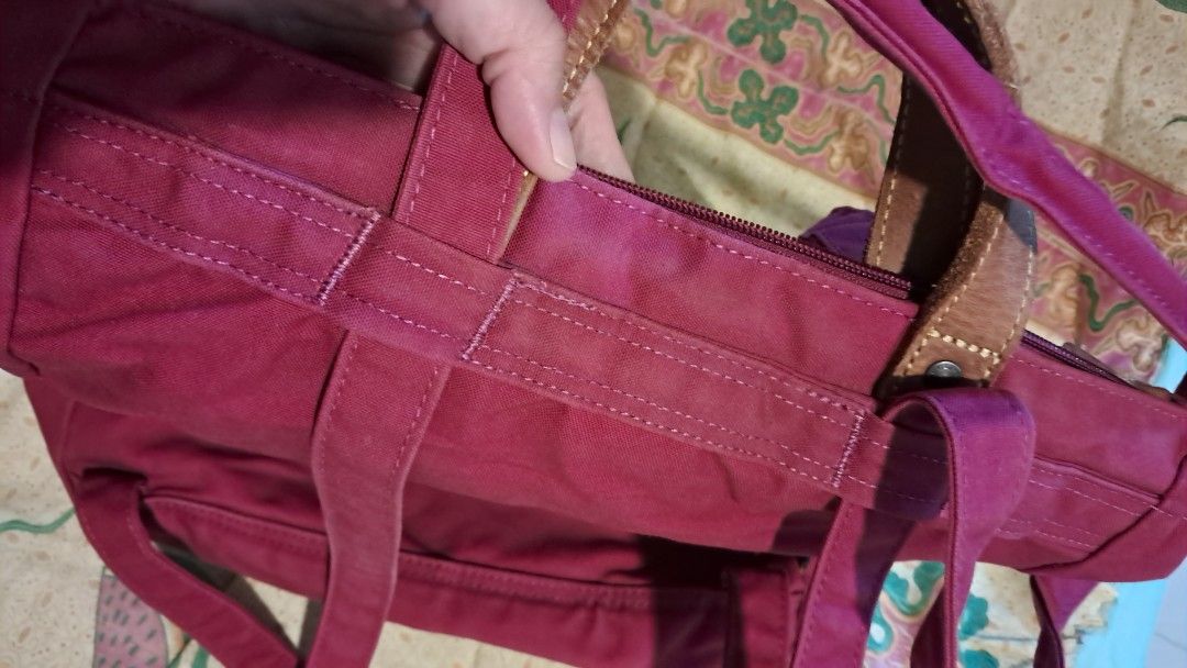 Fjallraven G-1000 Tote Bag (Category: Tote Bags) located in Cavite. Submitted by naning049 (Listing ID 1464426158, Image 3). Description: - Fjallraven tote bag in a rich deep berry color. - Crafted from durable G-1000 material. - Features stylish leather accents on the handles. - Convenient front zippered pocket for quick access. - Main compartment zips securely closed. - Perfect everyday size. needs a bit of cleaning PWEDE BACK PACK PWEDE TOTE B