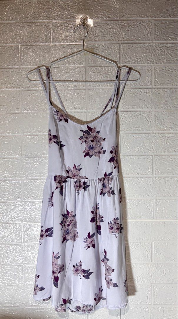 Floral Dress Coquette (Category: Dresses) located in Cebu City. Submitted by airahxoxo (Listing ID 1464510049, Image 1). Description: - Cute white mini dress - Purple floral print - Spaghetti straps - Criss-cross back detail - Lightweight and flowy fabric - Perfect for casual days or summer events - Easy to style with sandals or sneakers.