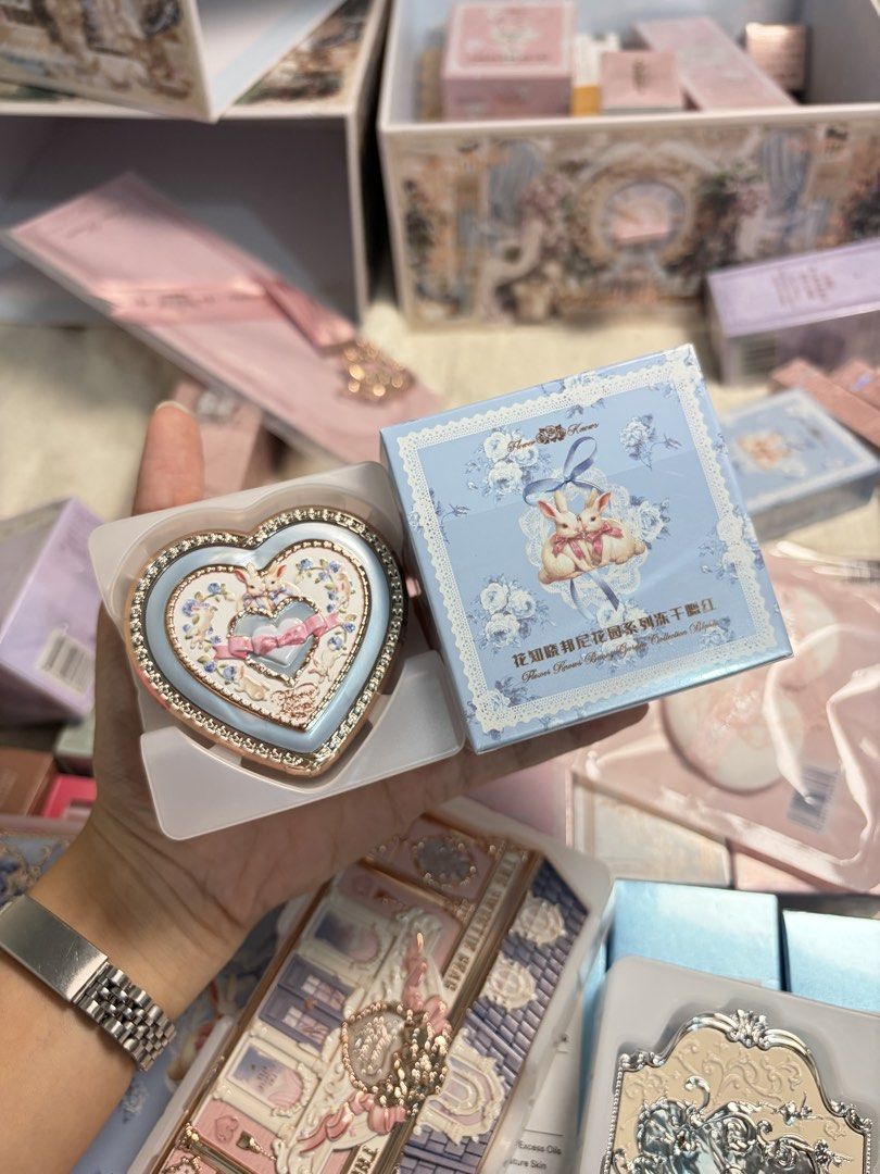 Flower Knows Bunny Garden Series Rabbit Blush (Category: Makeup) located in Caloocan City. Submitted by Mariane_ (Listing ID 1464483395, Image 1). Description: - 02 Bunny lullaby - Super cute heart-shaped blush compact - Features a lovely embossed floral design - Adorable bunny motif packaging - Comes in a pretty blue box with lace trim - Perfect for adding a pop of color to your cheeks.