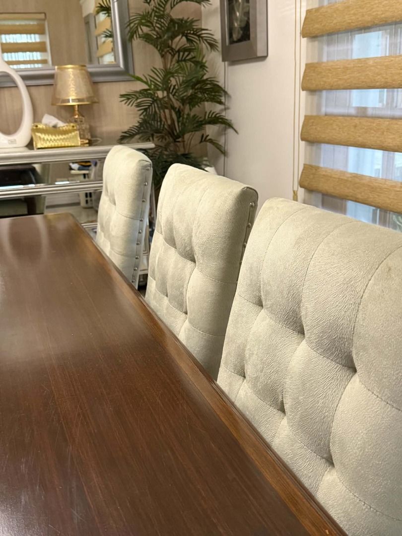 FOR SALE — 8-SEATER DINING SET (Category: Tables & Sets) located in Santa Rosa. Submitted by jen.cantila (Listing ID 1464548650, Image 3). Description: FOR SALE — 8-SEATER DINING SET Elegant and spacious 8-seater dining set, featuring a rich dark-wood rectangular dining table paired with 8 comfortable cream upholstered chairs. The tufted backrests and nailhead detailing give the chairs a refined classic look, while the warm wood finish makes the 