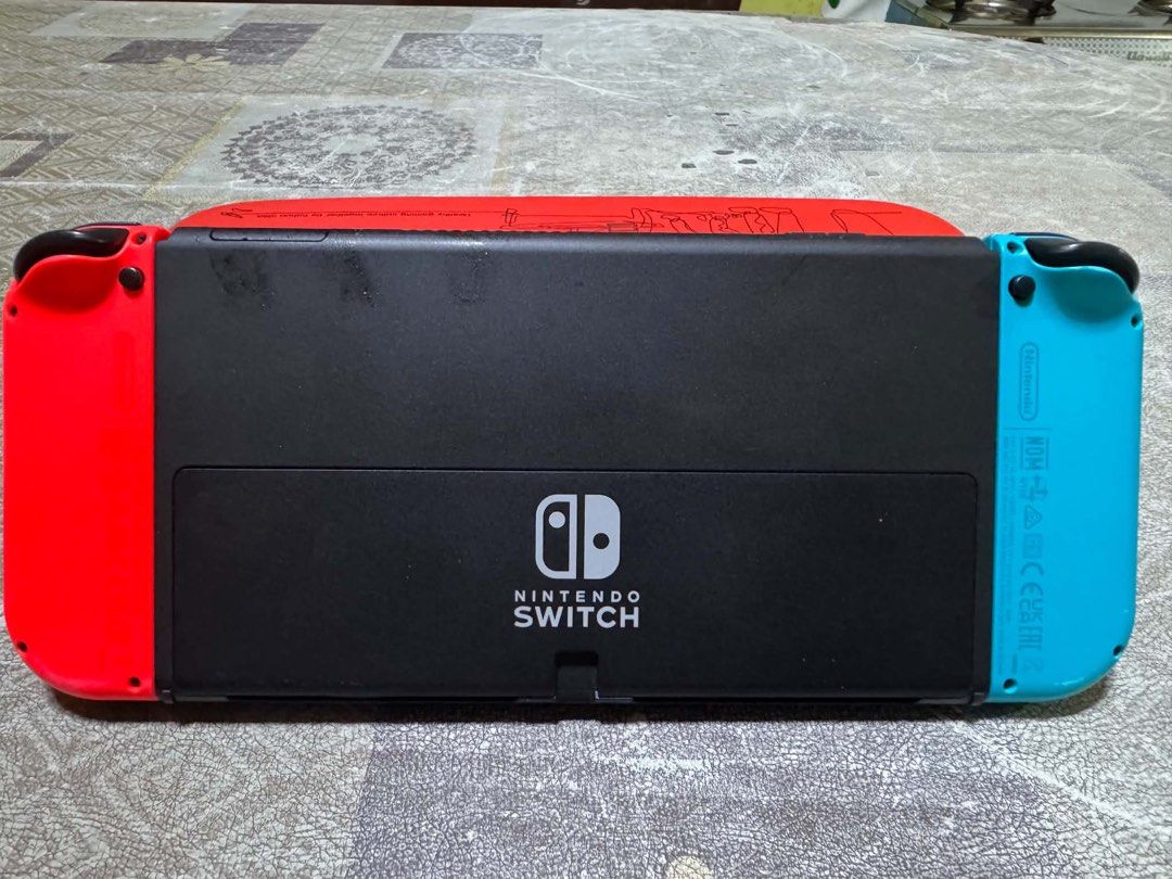 FOR SALE Nintendo Switch OLED (Category: Nintendo) located in Manila. Submitted by swiftcat.5d0063 (Listing ID 1464561156, Image 2). Description: ‼️ Selling as set for 15k ‼️ No issues, all buttons are working (the one on the screen is tempered glass) RFS: need funds Inclusions: 4 games (as seen on photo), 256gb SD card, case, and charger 📍 Preferably meet up around Batangas area ✉️ PM for more details.