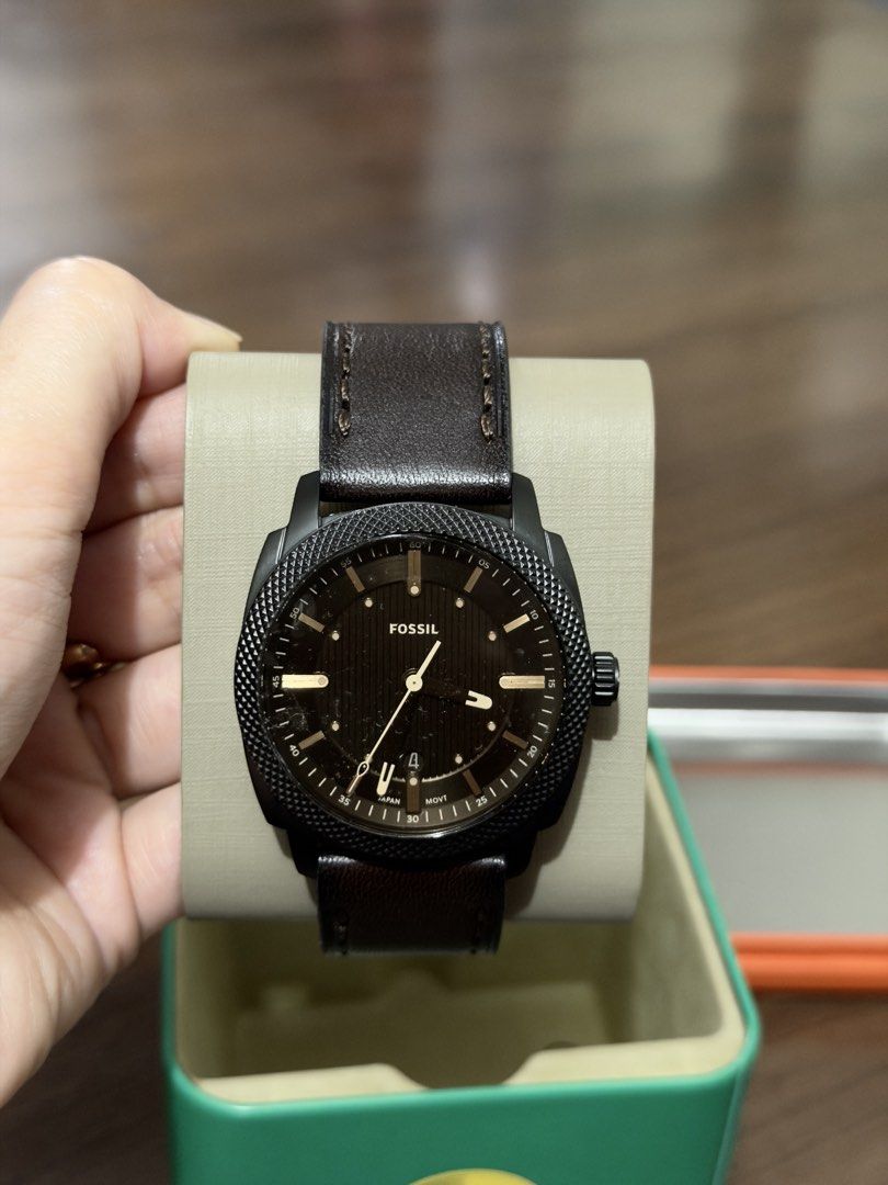 Fossil 1984 Records Watch with Leather Strap (Category: Men's Watches) located in Manila. Submitted by chohanmani51652 (Listing ID 1464534975, Image 2). Description: - Fossil watch - Dark brown leather strap - Black dial with silver accents - Includes original Fossil 'Records 1984' tin box - Comes with Fossil paper bag - Ideal for watch collectors.
