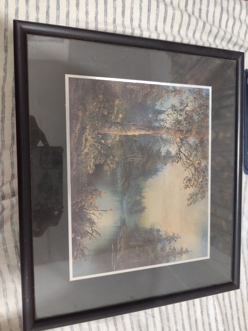 Framed Landscape Painting with Black Frame (Category: Frames & Pictures) located in Manila. Submitted by marriage031073advocate (Listing ID 1464428631, Image 1). Description: - Beautiful framed painting of a serene landscape. - Features a tranquil river scene with trees and soft lighting. - Comes in a classic black frame. - Ready to hang. - Adds a peaceful vibe to any room. - Ideal for nature lovers..