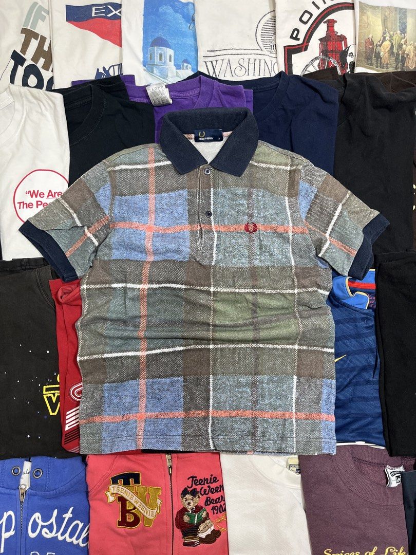 Fred Perry Plaid Polo Shirt Size S (Category: Tshirts & Polo Shirts ) located in Baao. Submitted by plainclothesdept (Listing ID 1464534951, Image 1). Description: Frèd Perrý Patterned Polo Shirt width - 18 in. length - 24 in. faded - Fred Perry Polo Shirt - Size: S - Classic plaid pattern - Embroidered iconic laurel wreath logo on chest - Navy blue ribbed knit collar - Button-up placket - Perfect for casual wear.