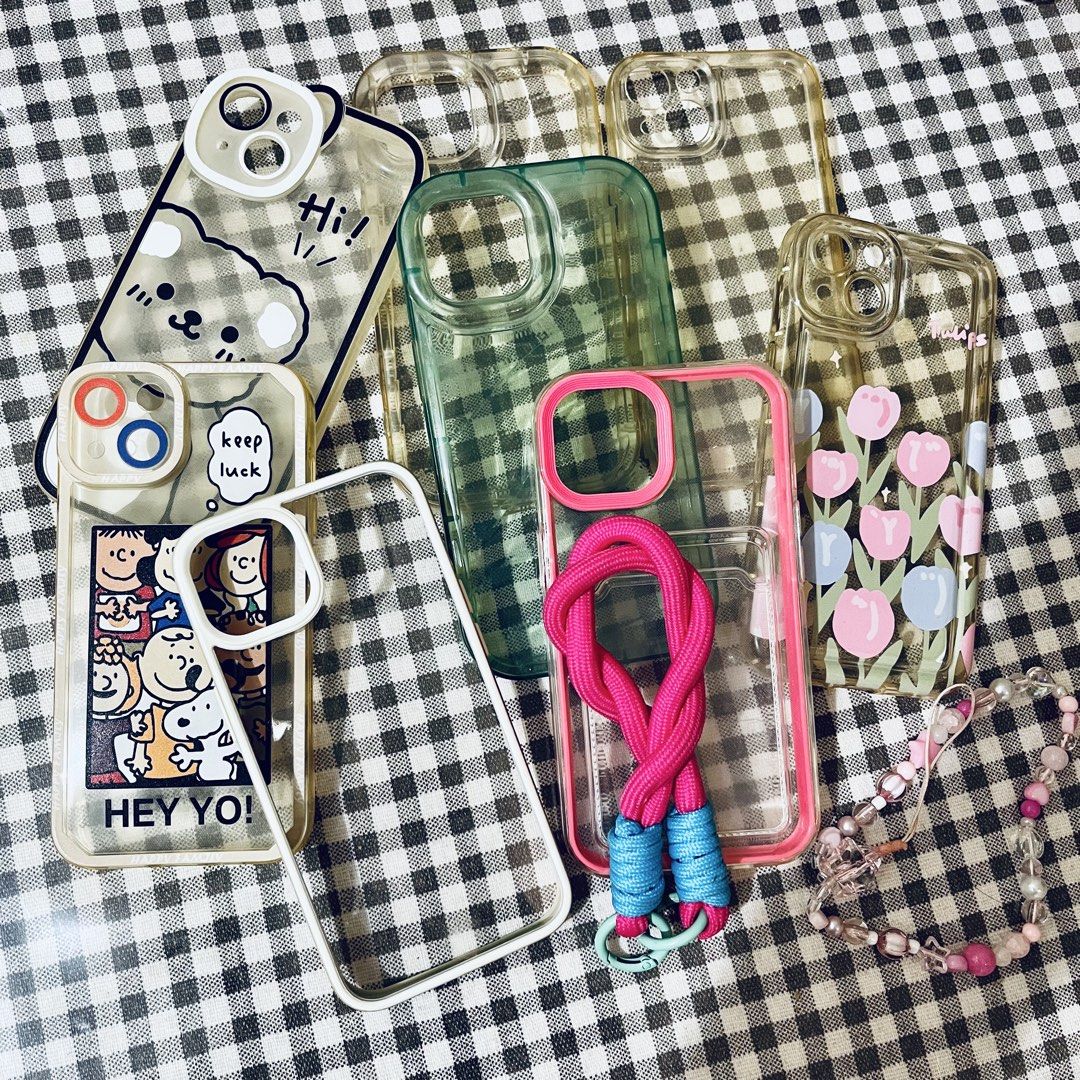 FREE TAKE ALL 8pcs iPhone 13 cases (Category: Cases & Sleeves) located in Makati City. Submitted by db0525 (Listing ID 1464456371, Image 1). Description: - Bundle of 8 iPhone 13 cases - Variety of designs: Snoopy, bear, tulips, green checkered, and more - Clear cases with playful graphics - Includes cases with straps and beaded accessories.